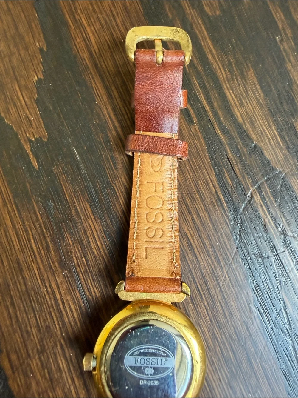 Vintage Fossil watch with a brown leather strap.